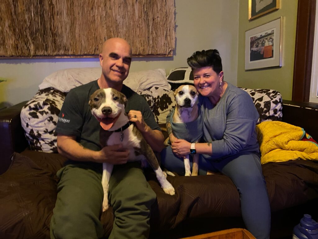 foster family with two dogs